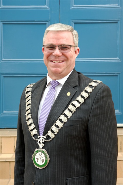 Man in suit smiling at camera